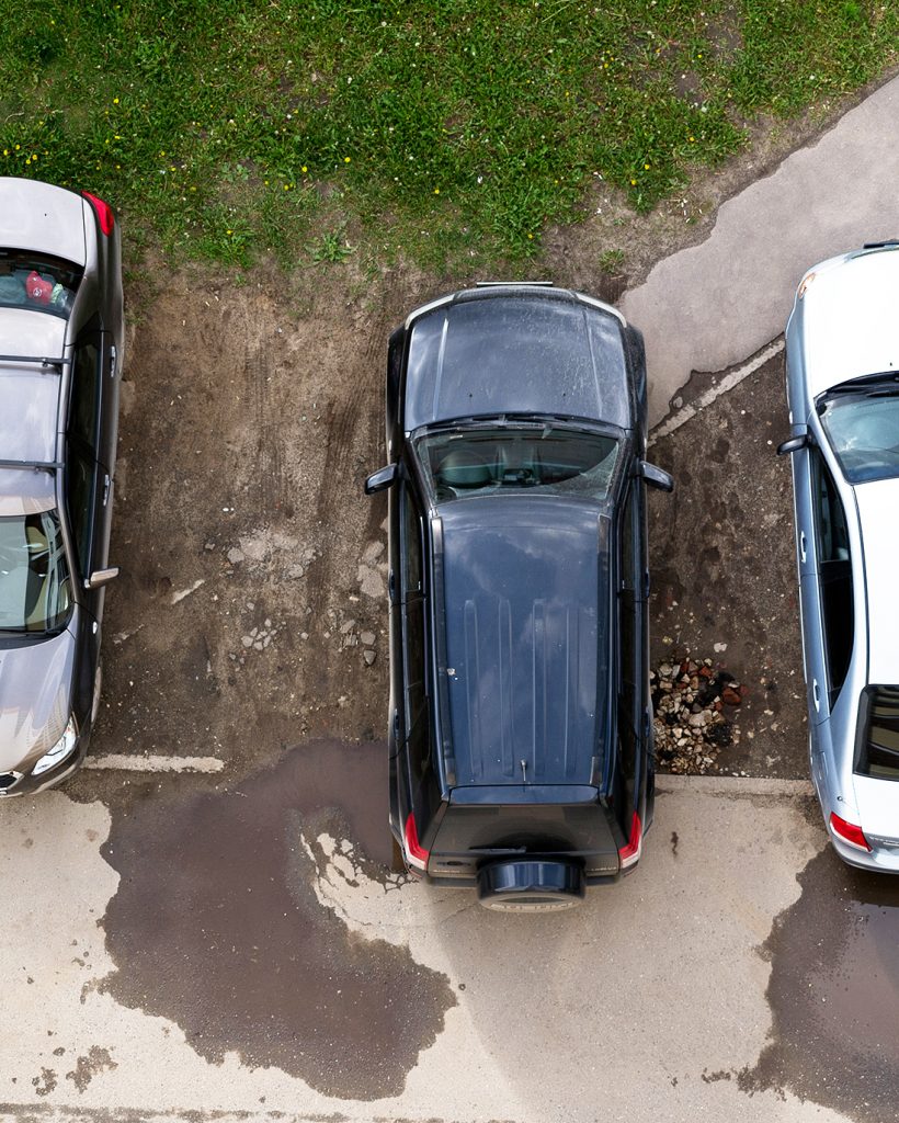 Yoshkar-Ola, Russia - June 14, 2017 Photo of cars parked on a lawn in one of the streets of Yoshkar-Ola, Russia